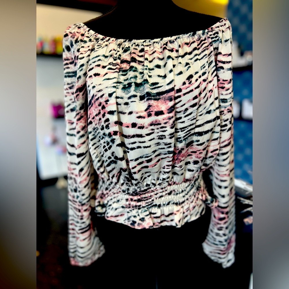 Naked Zebra long sleeved crop. Can wear on or off shoulder. New with tags.